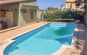 Отель Amazing home in Altavilla Milicia with Outdoor swimming pool, WiFi and 3 Bedrooms, Альтавилла Миличиа